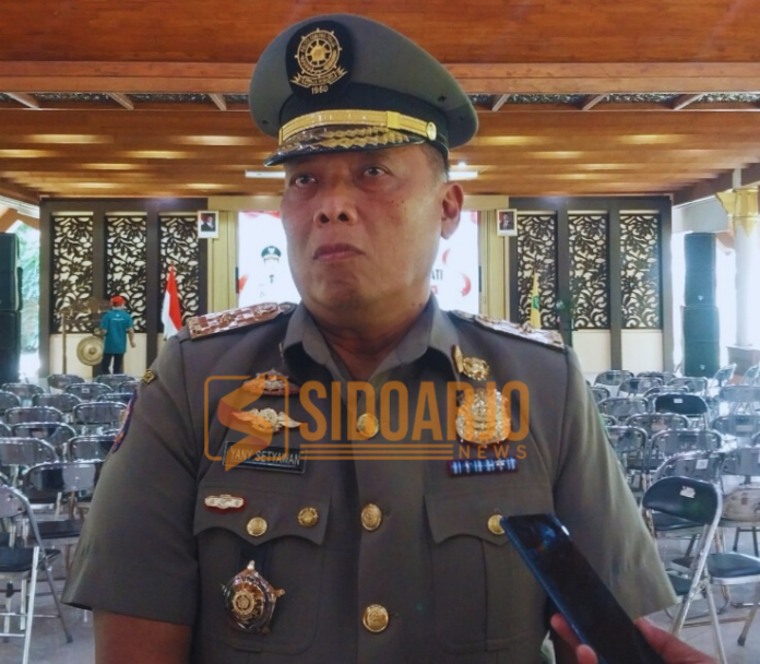 Kepala Satpol PP Sidoarjo, Yany Setyawan saat diwawancarai awak media/Foto: Ipung Syaiful