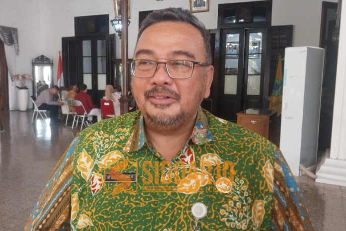Kepala Dinas Perkim-CKTR Sidoarjo, Bachruni Aryawan saat diwawancarai awak media terkait penyerahan fasum di Pendopo Delta Wibawa/Foto: Ipung Syaiful